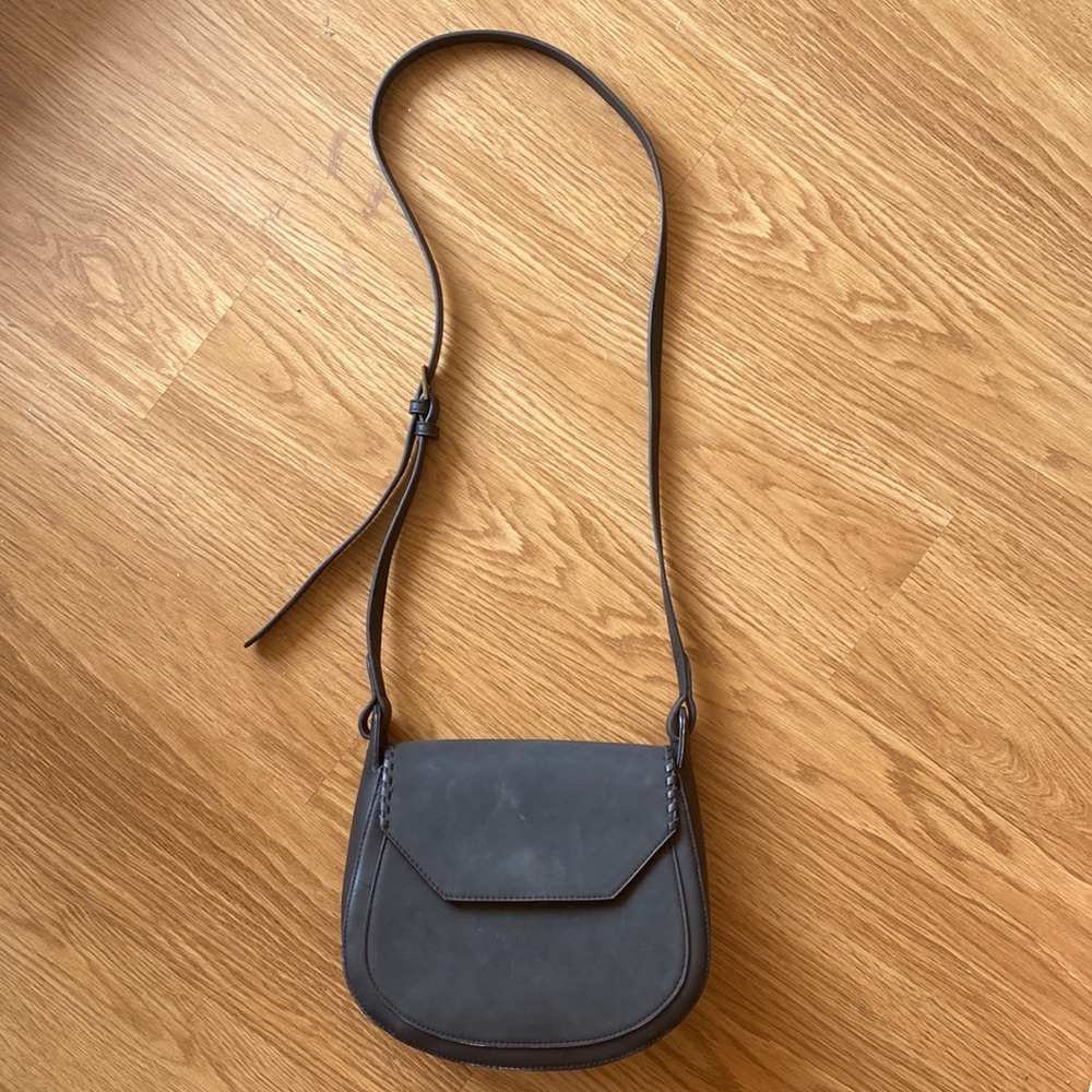 Black faux leather medium sized saddle cross body bag